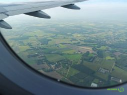window-of-airplane-and-view-from-above-the-landsca-2023-11-27-05-14-03-utc-min