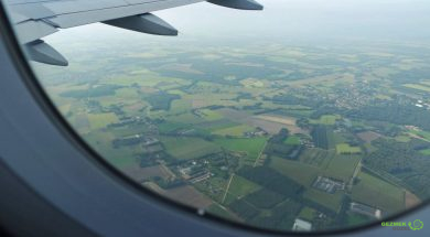 window-of-airplane-and-view-from-above-the-landsca-2023-11-27-05-14-03-utc-min